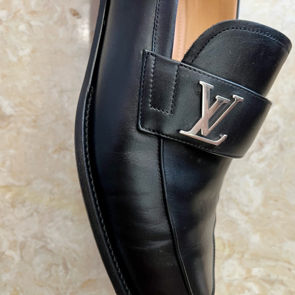 Louis Vuitton dressing men shoes. Used Black men shoes and in good condition.